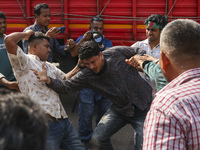 Students from anti-discrimination movements attack an Awami League supporter in Dhaka, Bangladesh, on November 10, 2024. (