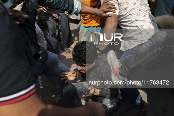 Students from anti-discrimination movements attack an Awami League supporter in Dhaka, Bangladesh, on November 10, 2024. 