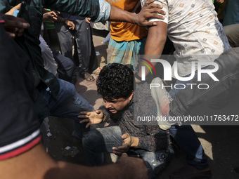 Students from anti-discrimination movements attack an Awami League supporter in Dhaka, Bangladesh, on November 10, 2024. (