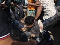 Students from anti-discrimination movements attack an Awami League supporter in Dhaka, Bangladesh, on November 10, 2024. (