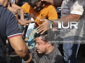 Students from anti-discrimination movements attack an Awami League supporter in Dhaka, Bangladesh, on November 10, 2024. (