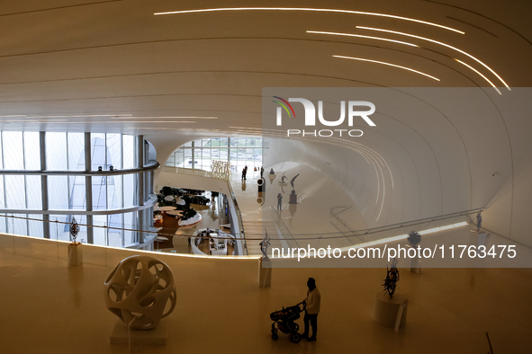 Visitors watch exhibitions in HeydarAliyev Centre in Baku, the capital of Azerbaijan on November 10, 2024. 