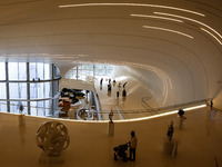 Visitors watch exhibitions in HeydarAliyev Centre in Baku, the capital of Azerbaijan on November 10, 2024. (