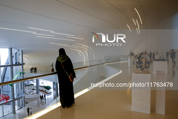 Visitors watch exhibitions in HeydarAliyev Centre in Baku, the capital of Azerbaijan on November 10, 2024. 