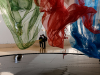 Visitors watch exhibitions in HeydarAliyev Centre in Baku, the capital of Azerbaijan on November 10, 2024. (