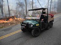 A wildfire impacts several forests in the area on Sunday morning in New York State as it is announced that a New York State parks employee w...