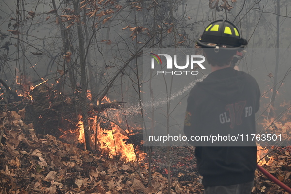 A wildfire impacts several forests in the area on Sunday morning in New York State as it is announced that a New York State parks employee w...