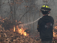 A wildfire impacts several forests in the area on Sunday morning in New York State as it is announced that a New York State parks employee w...