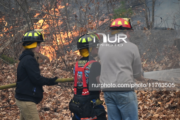 A wildfire impacts several forests in the area on Sunday morning in New York State as it is announced that a New York State parks employee w...