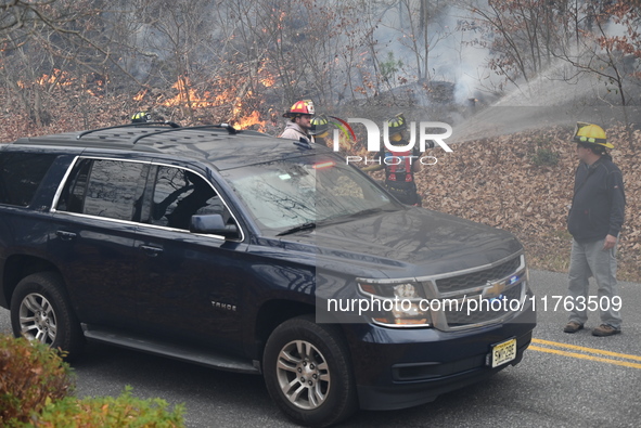 A wildfire impacts several forests in the area on Sunday morning in New York State as it is announced that a New York State parks employee w...