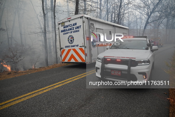 A wildfire impacts several forests in the area on Sunday morning in New York State as it is announced that a New York State parks employee w...