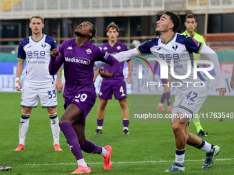 Christian Kouame of ACF Fiorentina and Diego Coppola of Hellas Verona FC ,battle for the ball during the Italian Serie A football match betw...