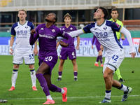 Christian Kouame of ACF Fiorentina and Diego Coppola of Hellas Verona FC ,battle for the ball during the Italian Serie A football match betw...