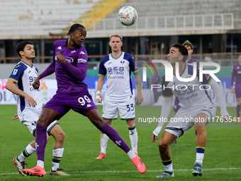 Christian Kouame of ACF Fiorentina and Diego Coppola of Hellas Verona FC ,battle for the ball during the Italian Serie A football match betw...