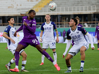 Christian Kouame of ACF Fiorentina and Diego Coppola of Hellas Verona FC ,battle for the ball during the Italian Serie A football match betw...