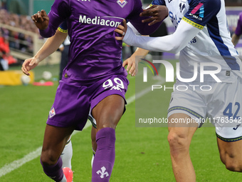 Christian Kouame of ACF Fiorentina and Diego Coppola of Hellas Verona FC ,battle for the ball during the Italian Serie A football match betw...