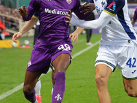 Christian Kouame of ACF Fiorentina and Diego Coppola of Hellas Verona FC ,battle for the ball during the Italian Serie A football match betw...