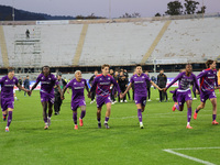 ACF Fiorentina players greet the curve of its fans after the victory between the Italian Serie A football match between ACF Fiorentina and H...