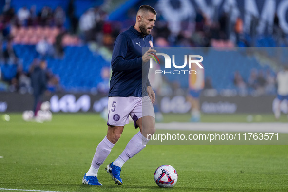 David Lopez of Girona FC warms up during the La Liga EA Sports 2024/25 football match between Getafe CF and Girona FC at Estadio Coliseum in...