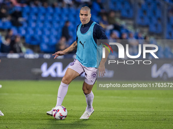 Oriol Romeu of Girona FC warms up during the La Liga EA Sports 2024/25 football match between Getafe CF and Girona FC at Estadio Coliseum in...