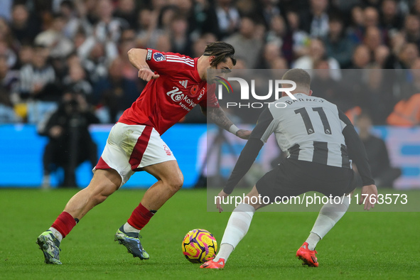 Jota Silva of Nottingham Forest battles with Harvey Barnes of Newcastle United during the Premier League match between Nottingham Forest and...