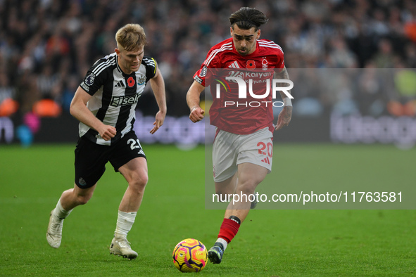 Jota Silva of Nottingham Forest is under pressure from Lewis Hall of Newcastle United during the Premier League match between Nottingham For...