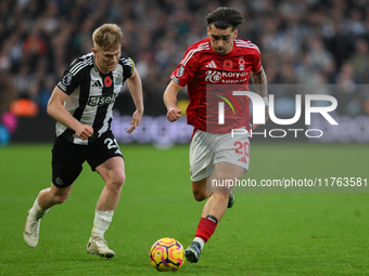 Jota Silva of Nottingham Forest is under pressure from Lewis Hall of Newcastle United during the Premier League match between Nottingham For...