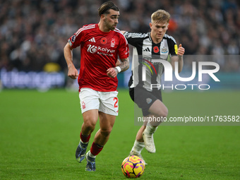 Jota Silva of Nottingham Forest is under pressure from Lewis Hall of Newcastle United during the Premier League match between Nottingham For...