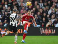 James Ward-Prowse of Nottingham Forest plays the ball forward under pressure from Bruno Guimaraes of Newcastle United during the Premier Lea...