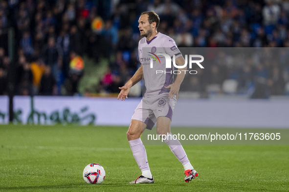 Daley Blind of Girona FC is in action with the ball during the La Liga EA Sports 2024/25 football match between Getafe CF and Girona FC at E...