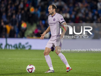 Daley Blind of Girona FC is in action with the ball during the La Liga EA Sports 2024/25 football match between Getafe CF and Girona FC at E...