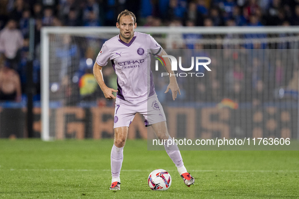 Daley Blind of Girona FC is in action with the ball during the La Liga EA Sports 2024/25 football match between Getafe CF and Girona FC at E...