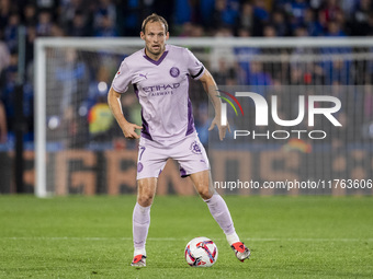 Daley Blind of Girona FC is in action with the ball during the La Liga EA Sports 2024/25 football match between Getafe CF and Girona FC at E...