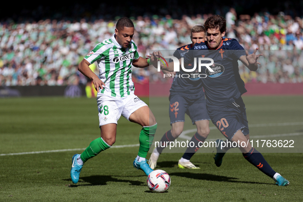 Vitor Roque of Real Betis battles for the ball during the La Liga EA Sport match between Real Betis and RC Celta de Vigo at Benito Villamari...