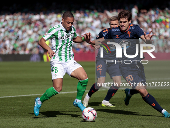 Vitor Roque of Real Betis battles for the ball during the La Liga EA Sport match between Real Betis and RC Celta de Vigo at Benito Villamari...