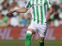 Johnny Cardoso of Real Betis runs with the ball during the La Liga EA Sport match between Real Betis and RC Celta de Vigo at Benito Villamar...