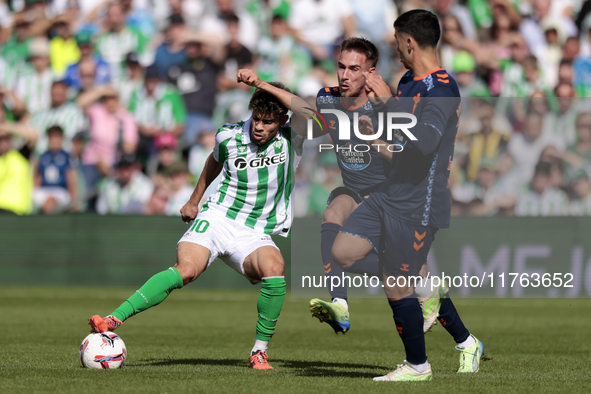 Ez Abde of Real Betis battles for the ball during the La Liga EA Sport match between Real Betis and RC Celta de Vigo at Benito Villamarin in...