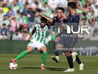 Ez Abde of Real Betis battles for the ball during the La Liga EA Sport match between Real Betis and RC Celta de Vigo at Benito Villamarin in...