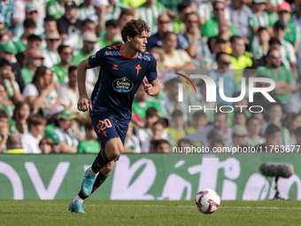 Marcos Alonso of RC Celta de Vigo runs with the ball during the La Liga EA Sport match between Real Betis and RC Celta de Vigo at Benito Vil...