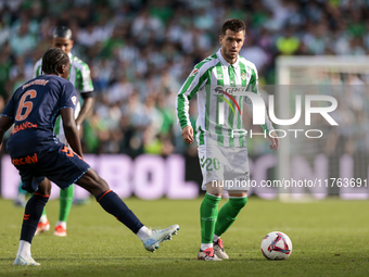 In Seville, Spain, on November 10, 2024, Giovani Lo Celso of Real Betis controls the ball during the La Liga EA Sport match between Real Bet...