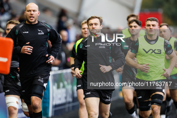 Brett Connon (center of picture) of Newcastle Falcons leads his players out for the warm-up for the Premiership Cup Pool A match between New...