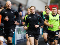 Brett Connon (center of picture) of Newcastle Falcons leads his players out for the warm-up for the Premiership Cup Pool A match between New...