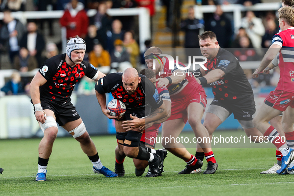 Kiran McDonald of Newcastle Falcons tries to break a tackle during the Premiership Cup Pool A match between Newcastle Falcons and Doncaster...