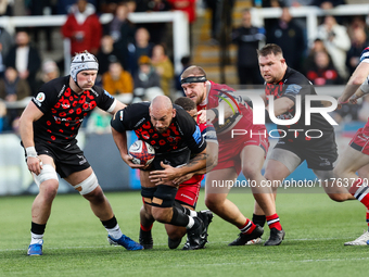 Kiran McDonald of Newcastle Falcons tries to break a tackle during the Premiership Cup Pool A match between Newcastle Falcons and Doncaster...