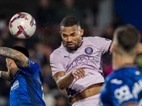 Yangel Herrera of Girona FC (C) heads the ball to score a goal during the La Liga EA Sports 2024/25 football match between Getafe CF and Gir...