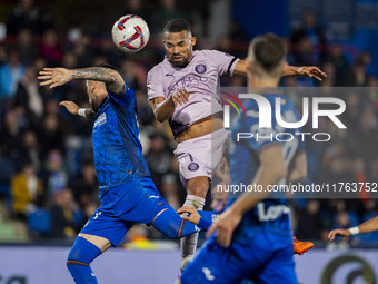 Yangel Herrera of Girona FC (C) heads the ball to score a goal during the La Liga EA Sports 2024/25 football match between Getafe CF and Gir...