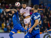 Yangel Herrera of Girona FC (C) heads the ball to score a goal during the La Liga EA Sports 2024/25 football match between Getafe CF and Gir...