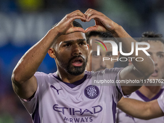 Yangel Herrera of Girona FC (C) celebrates his goal during the La Liga EA Sports 2024/25 football match between Getafe CF and Girona FC at E...