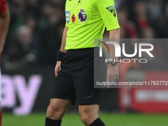 Referee Anthony Taylor officiates the Premier League match between Nottingham Forest and Newcastle United at the City Ground in Nottingham,...