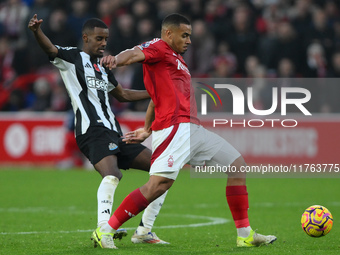 Murillo of Nottingham Forest shields the ball from Alexander Isak of Newcastle United during the Premier League match between Nottingham For...